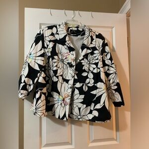 Black and white jacket with a pop of color.